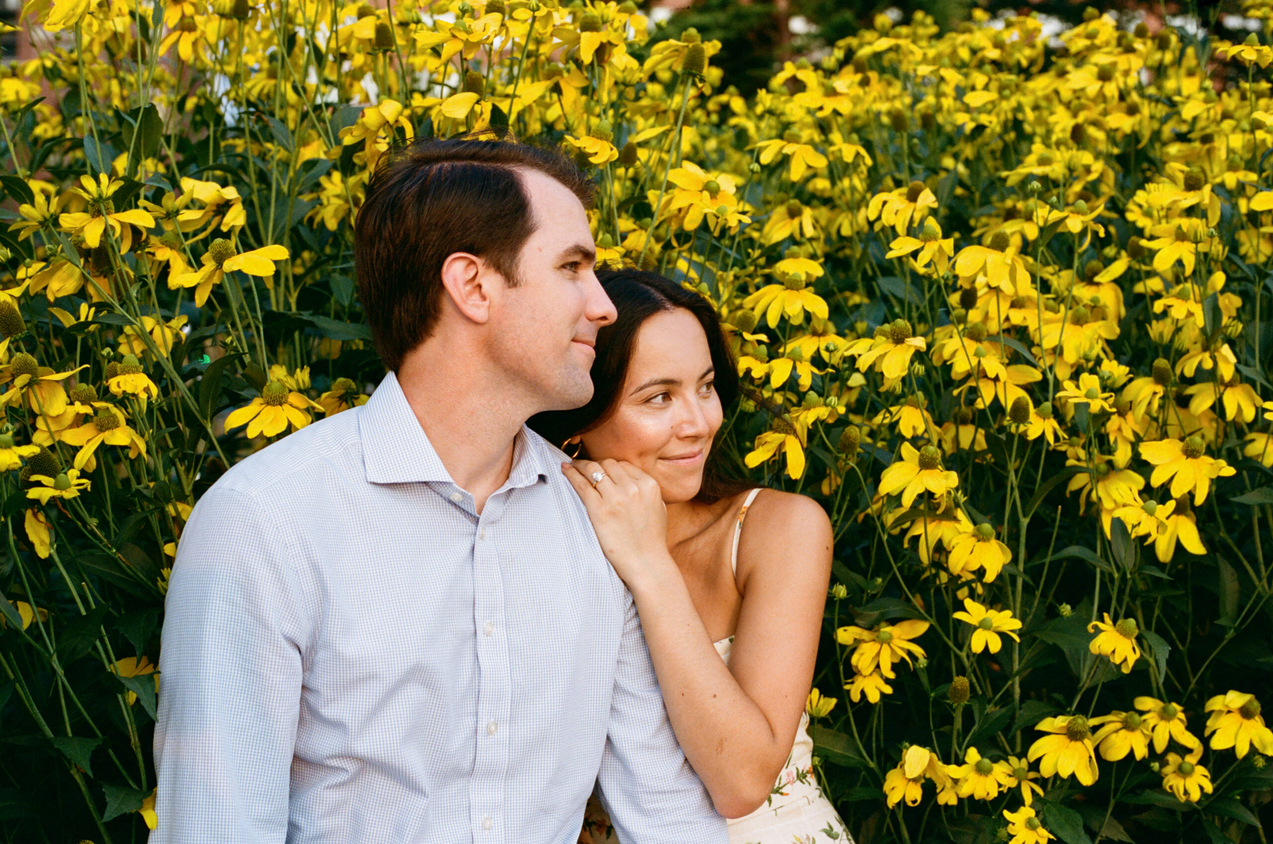 engagement photo in yellow flowers on the west side highway nyc shot by parkers pictures