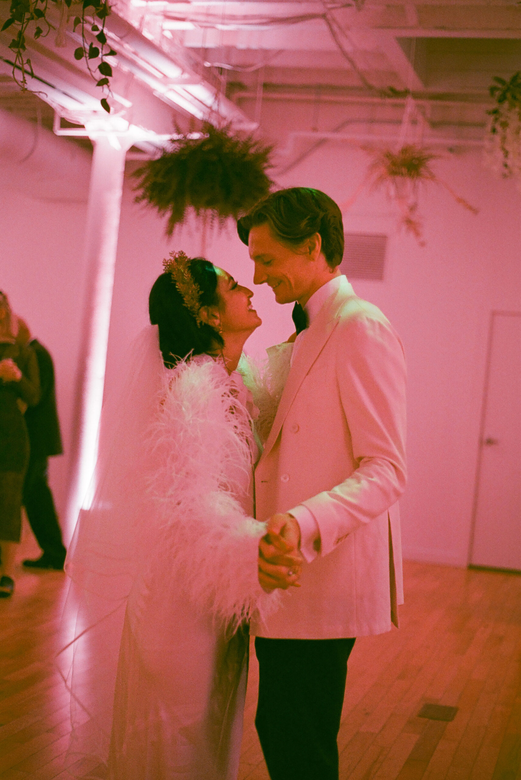 first dance in pink lighting shot on film by parkers pictures