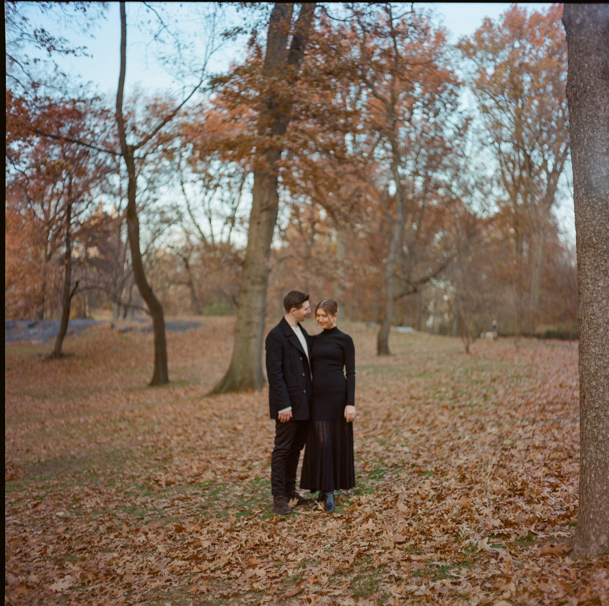 NYC Central Park Engagement Fall couple among leaves taken on film by Parkers Pictures