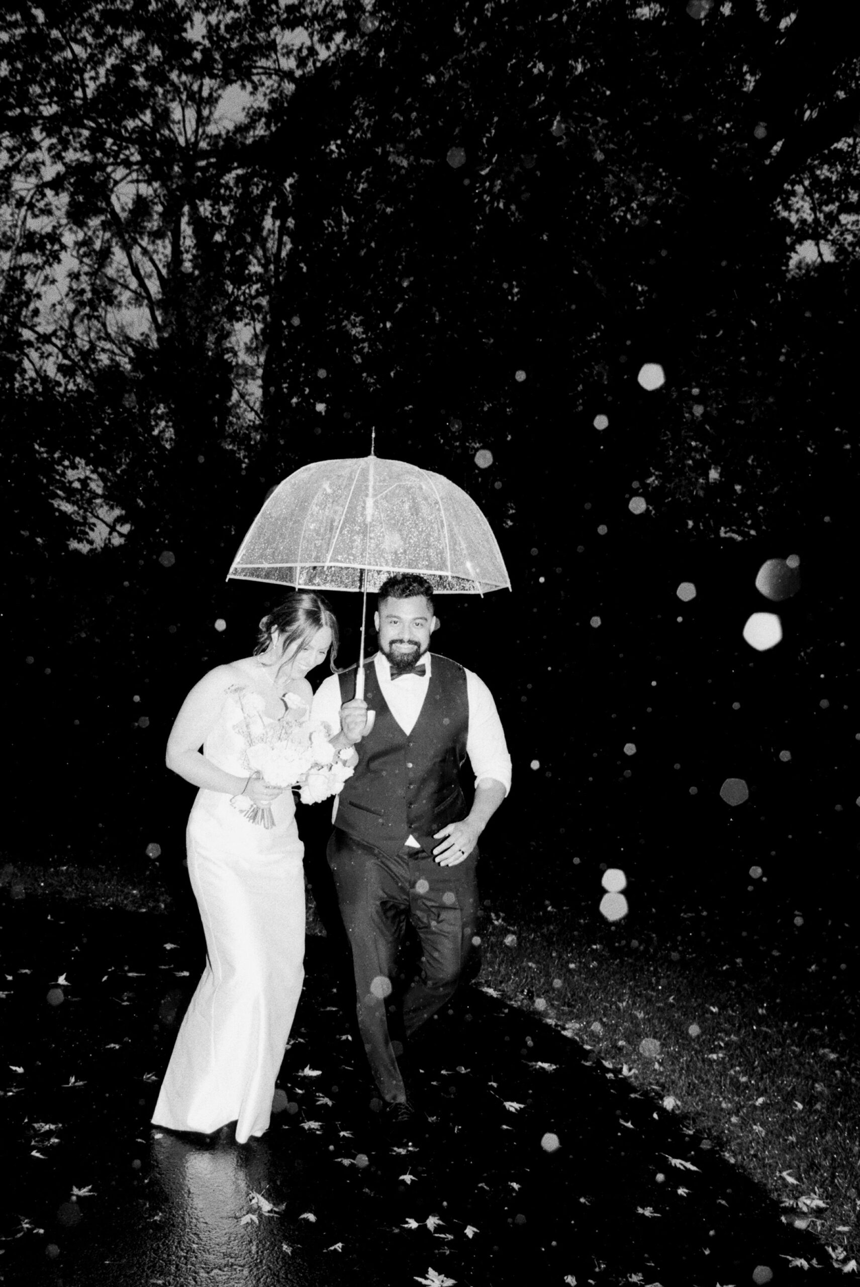 Couple Running Through the Rain taken by Parkers Pictures