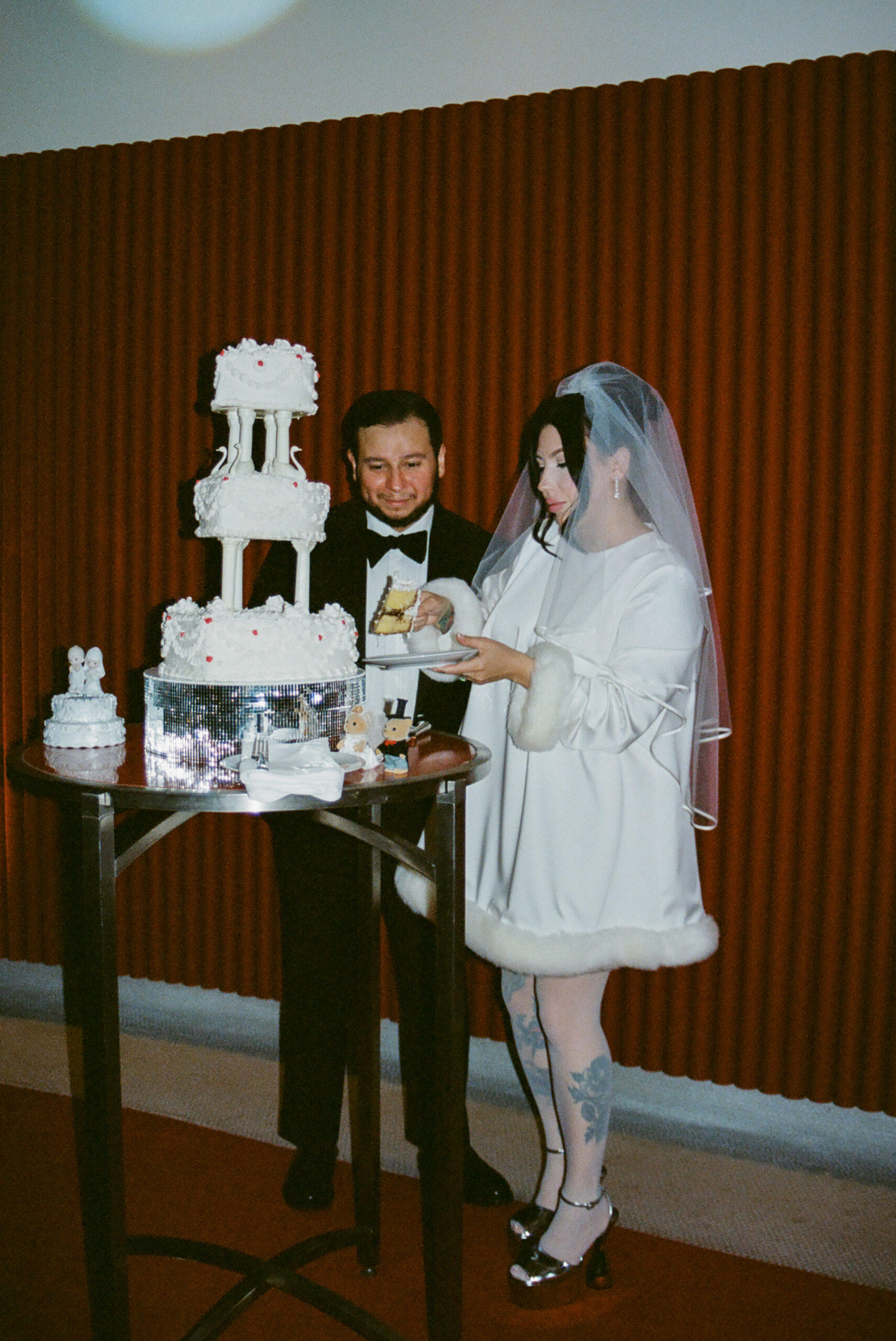 TWA vintage wedding cake cutting shot on 35mm film by parkers pictures