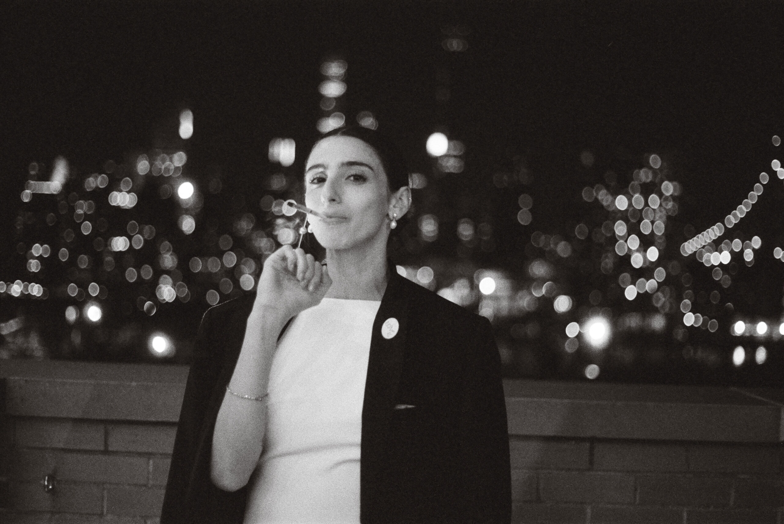 bride smoking against NYC Skyline taken by Parkers Pictures