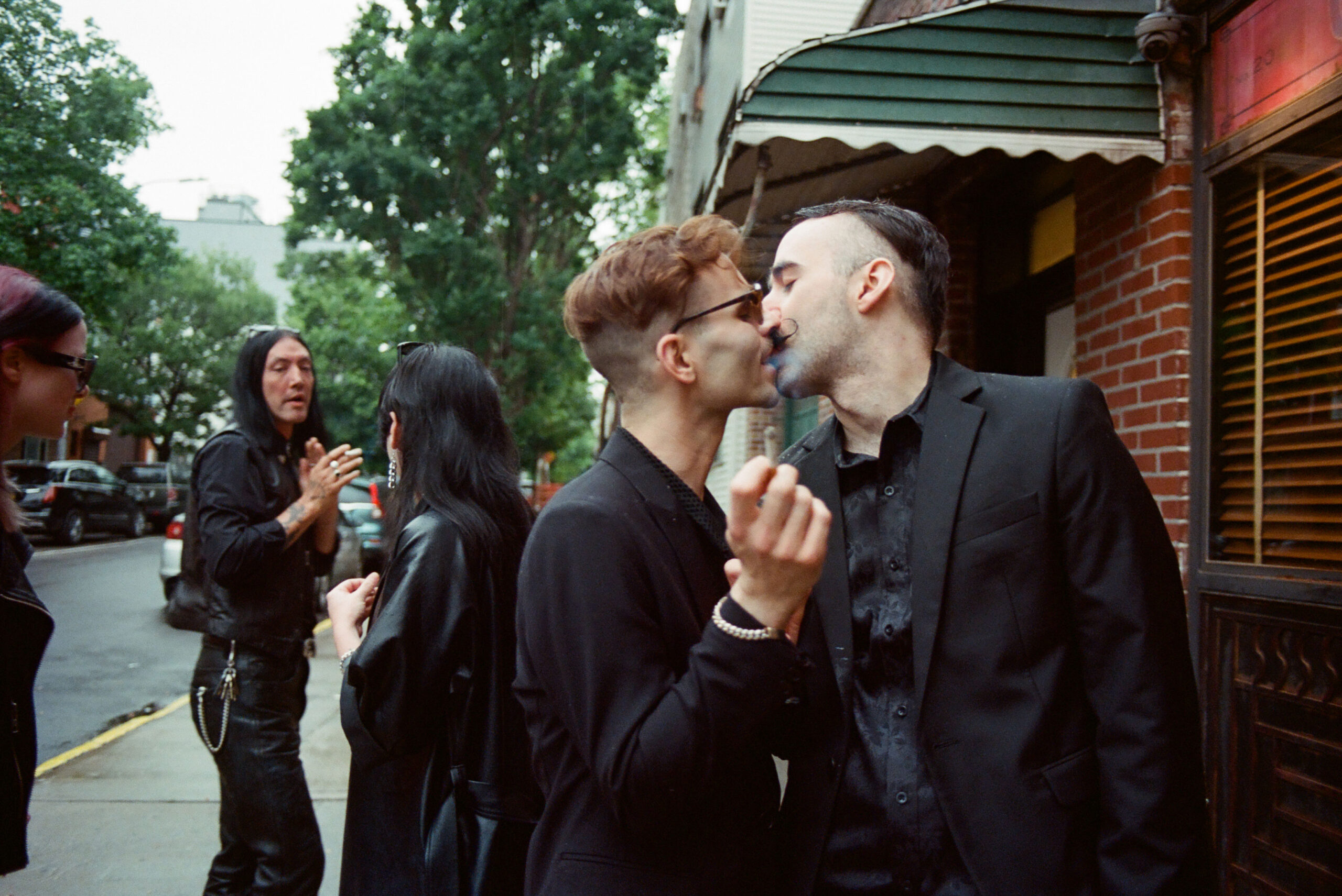 couple smoking outside a wedding venue nyc shot on film by parkers pictures